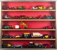 A collection of diecast vehicles in three display cabinets.