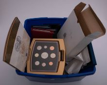 A collection of Royal Mint proof sets boxed.