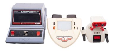 Three late 20th Century Tomy electronic toys.
