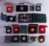 A mixed collection of silver boxed coins.