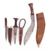 A late 19th Century Kukri knife with leather sheath.