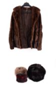 A 20th Century lady's fur jacket, together with two fur stoles and a black fur hat.