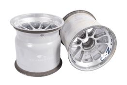 Two mid 2000s Williams F1 Team racing car rims.