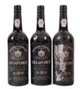Three bottles of Delaforce 1994 vintage port. One label damaged, 75cl, 21% vol.