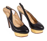 Charlotte Olympia. A pair of black and gold Charlotte Olympia platform leather heels, size 39.