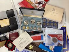 Fifty World coin sets / cased coins, including silver.