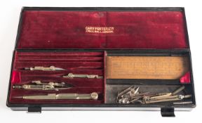 A cased part geometry set , maker Cary, London, containing boxwood rules and steel dividers,