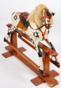 A 20th century painted rocking horse, in black and white with white mane and tail,