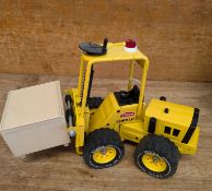 A Tonka Toys XR-101 fork lift truck, in yellow with black trim and wheels,