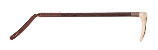 A silver mounted Swaine riding crop, having a carved antler handle and leather shaft,