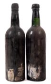 Two bottles of port. Indeterminate vintage, both labels not present, no qty or vols shown.