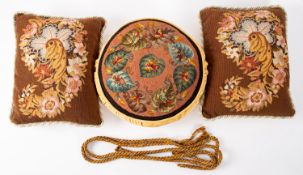 A circular cushion with beaded decoration, 31cm diameter approx,