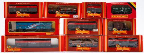 Ten Hornby OO/HO goods wagons. Including ore wagons, closed vans and ferry vans etc, all boxed.