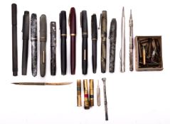 A collection of various fountain pens, including three 14ct nibs plus spare nibs etc.
