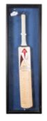A Slazenger cricket bat signed by the England 2006/07 Ashes squad.