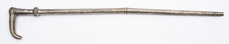 An Indian white metal walking cane,