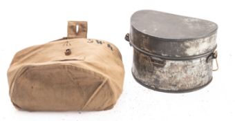 A mess tin in canvas cover