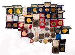 A collection of mainly 20th Century medallions in a tub, including a 1926 General Strike Medallion,