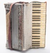 A Royal Standard 120 key accordion in silver with pink lettering,