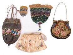 Five 20th Century silkwork and beadwork lady's handbags.