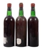 Three bottles of vintage port.