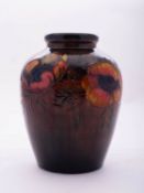 A Walter Moorcroft pottery vase of oviform tube lined in the Flambé Anemone pattern, 16cm high,