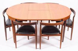 A Danish teak 'Roundette' extending dining table and six matching chairs,