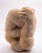 A contemporary sculpted limestone abstract figure,