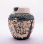 A Moorcroft pottery jar and cover of oviform and tube lined in the Treetops pattern after a design