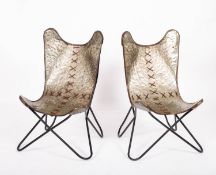 A pair of planished aluminium 'Butterfly' chairs,
