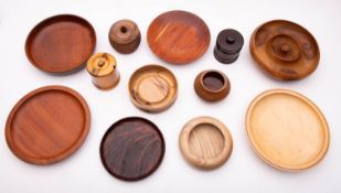 A collection of twelve turned and stained wood bowls and other vessels,