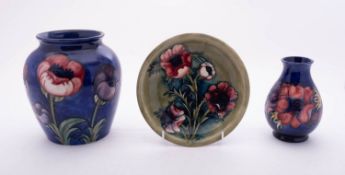 Three pieces of Moorcroft pottery each tube lined in the Anemone pattern,