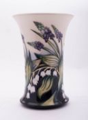 A Moorcroft pottery vase of waisted cylindrical form tube lined in the Taming pattern after a
