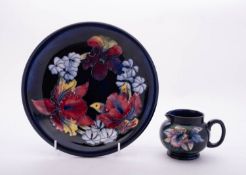 Two pieces of Walter Moorcroft pottery tube lined in the Orchid pattern,