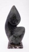 An East African, probably Shona sculpted veined green stone abstract figure,