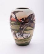 A Moorcroft pottery limited edition vase of oviform tube lined in the Swifts pattern after a design