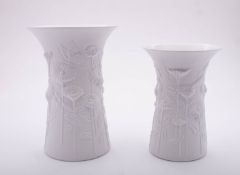 Two Kaiser porcelain matt white vases embossed with daisies after a design by Manfred Frey,