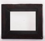 A modern ebonised wood framed rectangular wall mirror, Belgian make,