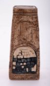 A Troika coffin vase with abstract blue and green decoration on a textured brown ground,