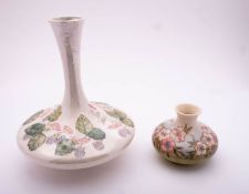 A Moorcroft pottery vase of squat form tube lined in the Spring Blossom pattern after a design by