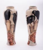 A pair of Moorcroft pottery limited edition vases of slender baluster form each tube lined in the