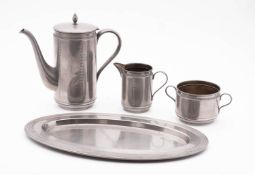 A WMF embossed metal coffee service; comprising an oval tray, coffee pot, milk jug and sugar bowl,