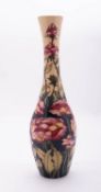 A Moorcroft pottery limited edition vase of slender club shaped form tube lined in the Centifolia