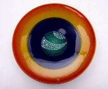 A set of nine Poole pottery 'Alignment of the Planets' chargers after a limited edition by Alan