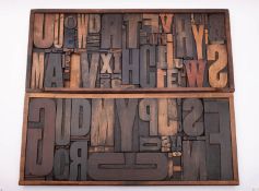 Two stained wood type compositor's trays, with letter blocks,