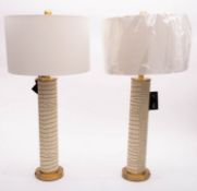 Safavieh, New York; a pair of contemporary table lamps; with cylindrical fabric shades,