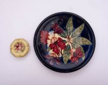 A large Moorcroft pottery plate tube lined in the Simeon pattern after a design by Philip Gibson,