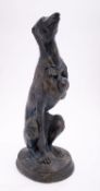 A painted composition model of a seated hound, modern; portrayed as seated on his haunches,