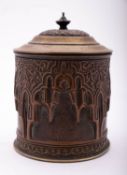 A repousse copper and brass mounted tobacco barrel,