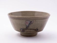 A St Ives stoneware bowl decorated with tenmoku 'Z' motifs under pale celadon,